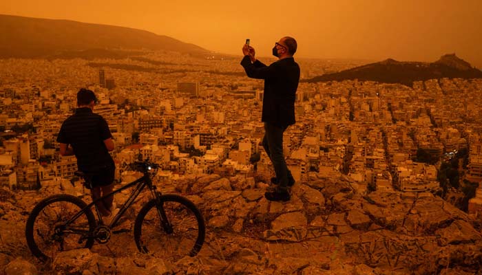 A look at Athens through orange-yellow dust filter. — AFP/File