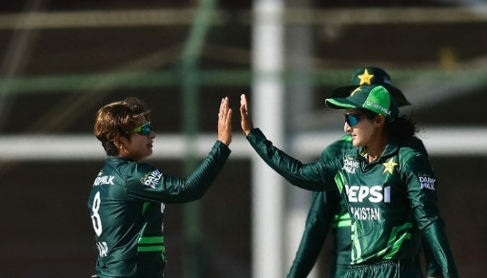 Pakistan womens cricket team players interact during a match. — PCB website/File