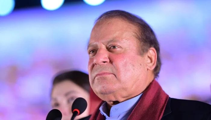 PML-N supremo Nawaz Sharif looks at his supporters gathered at Minar-e-Pakistan during an event held to welcome him in Lahore on October 21, 2023. — X/@pmln_org