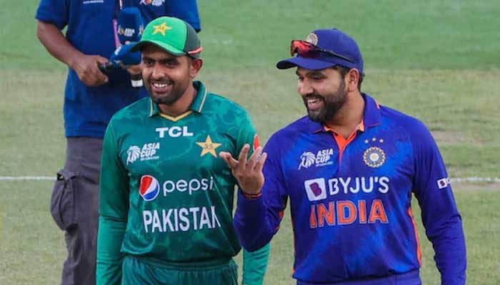 Pakistans skipper Babar Azam (left) pictured alongside Indian captain Rohit Sharma. — AFP/File