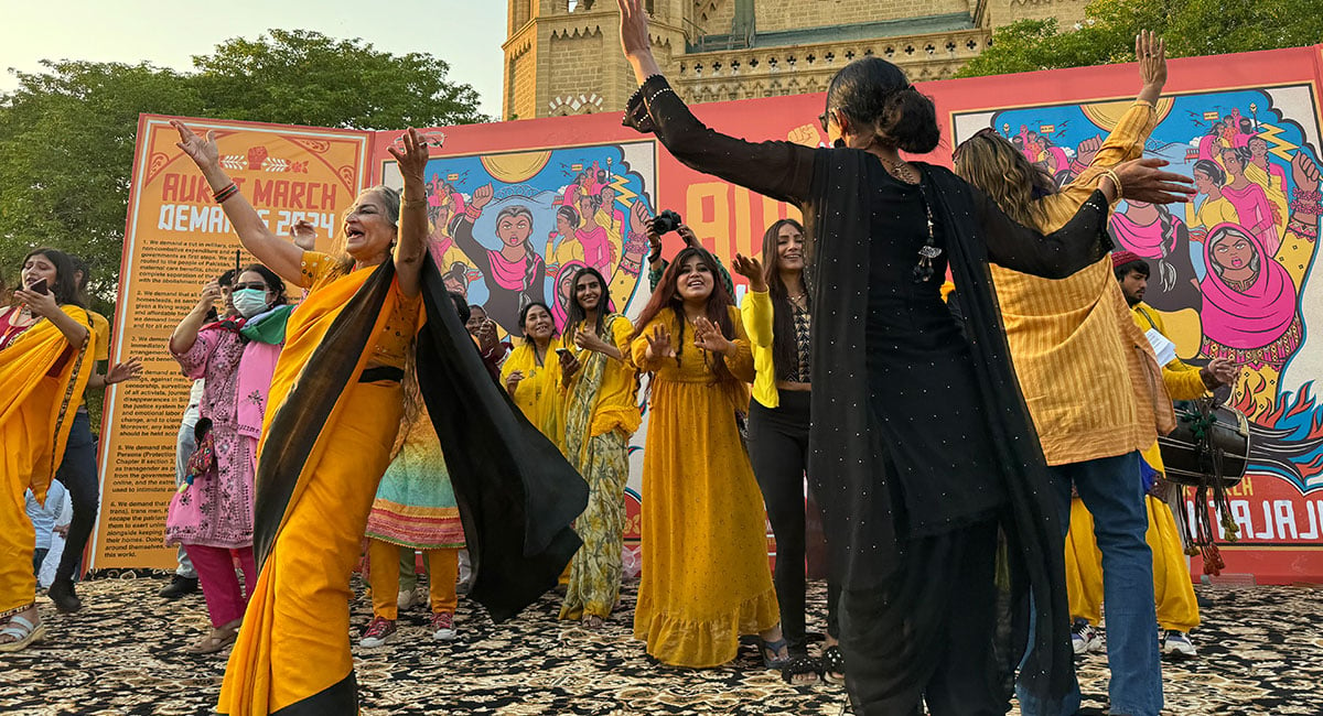 Sheema Kermani and Aurat March organisers dance during the March 8 Aurat March event in Karachis Frere Hall on March 8, 2024. — Geo.tv/Rabia Mushtaq