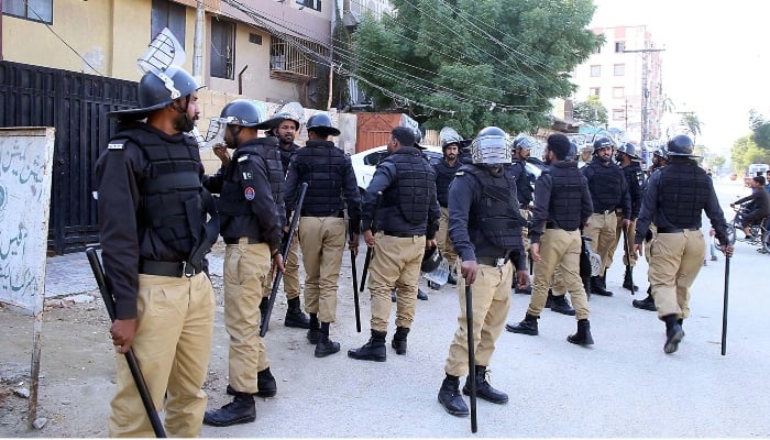 Police personnel stand guard outside the Election Commission of Pakistan office in Hyderabad on February 10, 2024. —INP