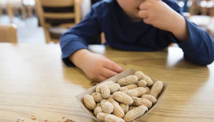 How can parents protect their children from peanut allergies?