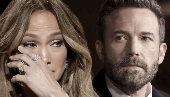 Ben Affleck ‘forcefully smiles as Jennifer Lopez kisses him on cheek