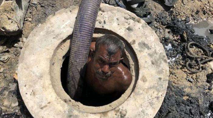 Indignity, disease, death — the life of a sewer worker in Pakistan