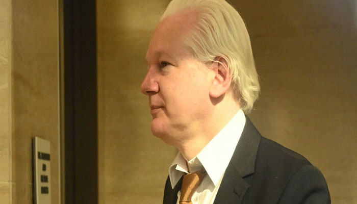 WikiLeaks founder Julian Assange walks through the US Federal Courthouse in the Commonwealth of the Northern Mariana Islands in Saipan, Northern Mariana Islands, on June 26, 2024. — AFP