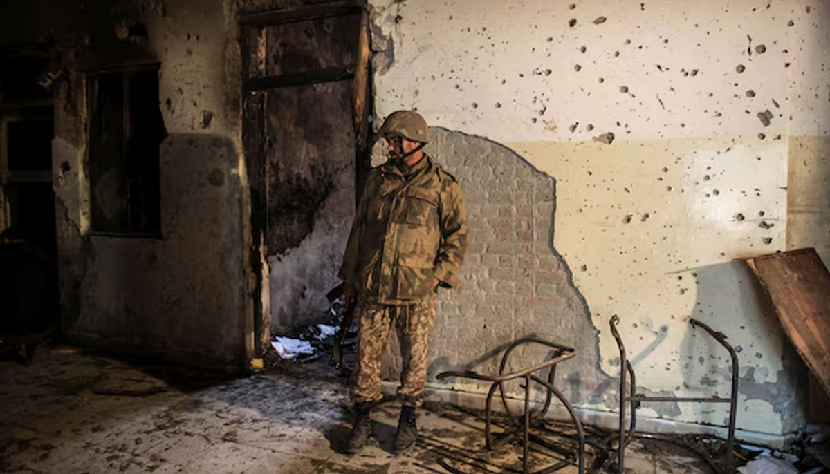 An army soldier inspects the Army Public School, which was attacked by Taliban gunmen, in Peshawar, December 17, 2014. — Reuters
