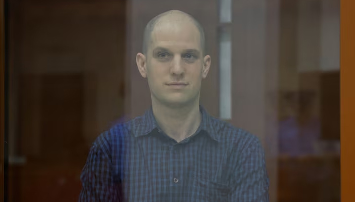 Wall Street Journal reporter Evan Gershkovich, who stands trial on spying charges, is seen inside an enclosure for defendants before a court hearing in Yekaterinburg, Russia June 26, 2024. — Reuters/File