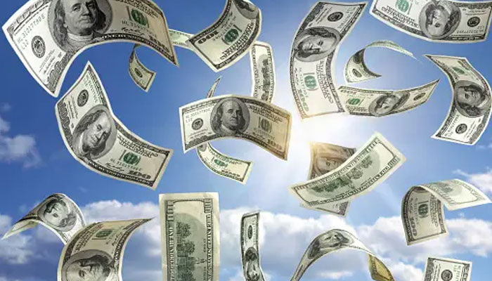 A representational image depicting dollar bills with an image of a cloudy sky as the backdrop. — Unsplash/File