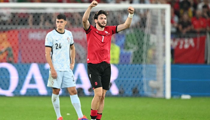Georgias forward #07 Khvicha Kvaratskhelia celebrates his teams second goal during the UEFA Euro 2024 Group F football match between Georgia and Portugal at the Arena AufSchalke in Gelsenkirchen on June 26, 2024. — AFP