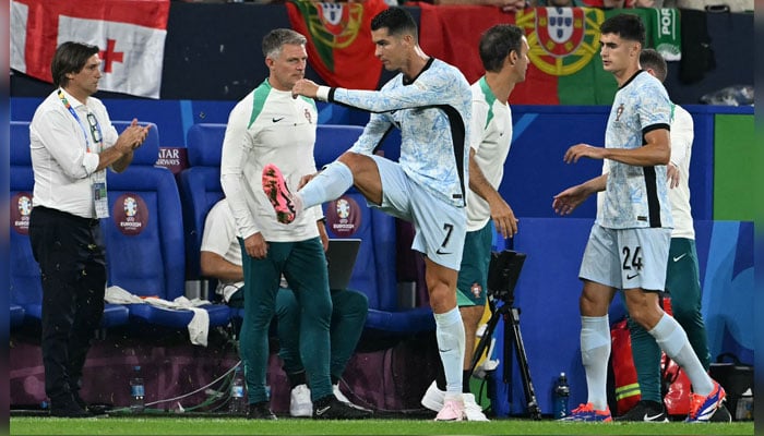 Portugals Cristiano Ronaldo reacts as he leaves the pitch to be substituted during the UEFA Euro 2024 Group F match against Georgia at the Arena AufSchalke in Gelsenkirchen on June 26, 2024. — AFP