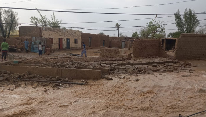 A collapsed wall of a building due to heavy rains can be seen in this image. — Reporter