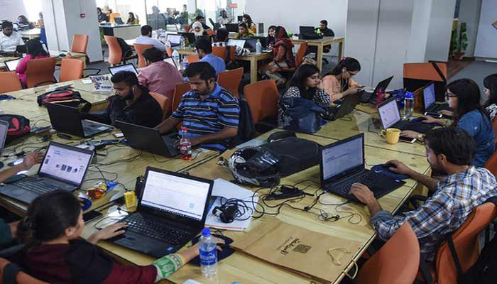 A representational image of young people working in a company. — AFP/File
