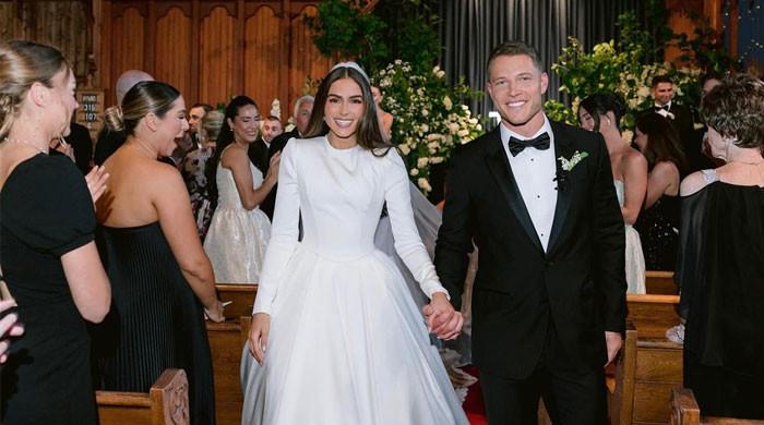 Olivia Culpo's groom Christian McCaffrey claps back at wedding dress critic