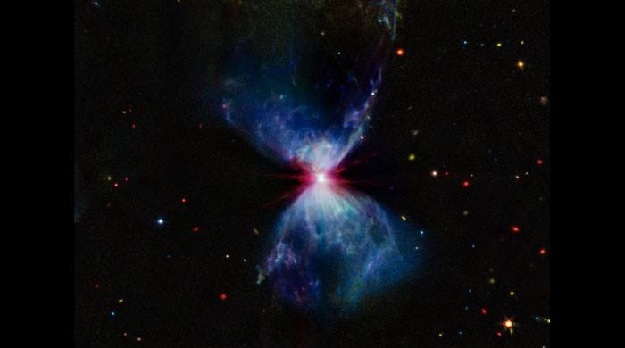 JWST captures infant star creating red, white, blue fireworks