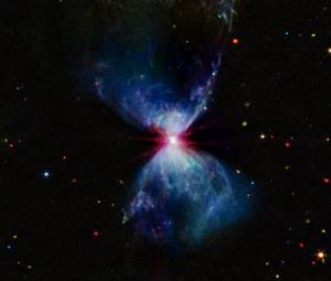 JWST captures infant star creating red, white, blue fireworks