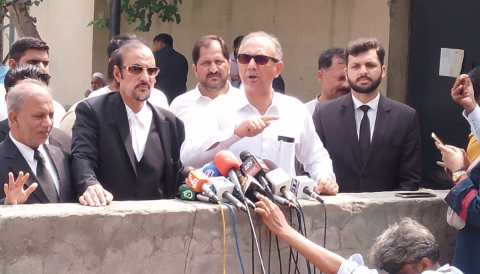Leader of Opposition in National Assembly Omar Ayub (centre) speaking to media in Islamabad on July 9, 2024. —Facebook/ OmarAyubKhan.Official