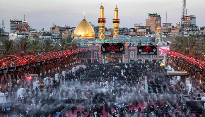 Shia Muslim devotees gathering to attend a mourning ritual on the eve of Ashura at the shrine of Imam Abu Al Fadl al Abbas in Iraqs central city of Karbala on July 15, 2024. — AFP