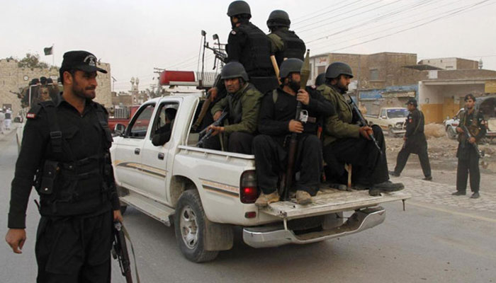 In this undated photo, security officials patrol on a street in Jamrud.— Reuters