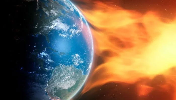 A representative image of earth being hit by a solar storm.— Science Focus/File