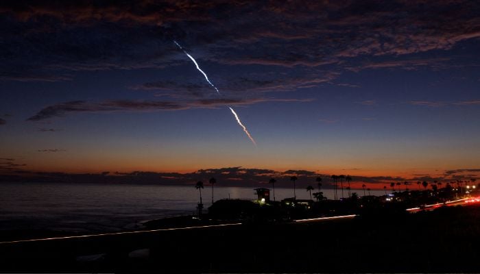 An evening launch of a SpaceX Falcon 9 rocket carrying 20 Starlink V2 Mini satellites, from Space Launch Complex at Vandenberg Space Force Base is seen over the Pacific Ocean from Encinitas, California, US on June 23, 2024.