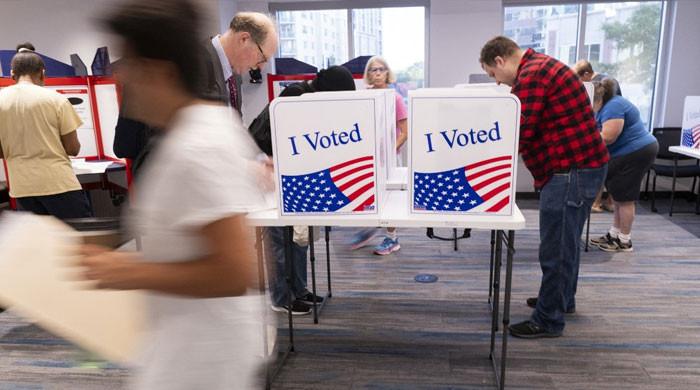 First early votes cast in knife-edge US presidential election