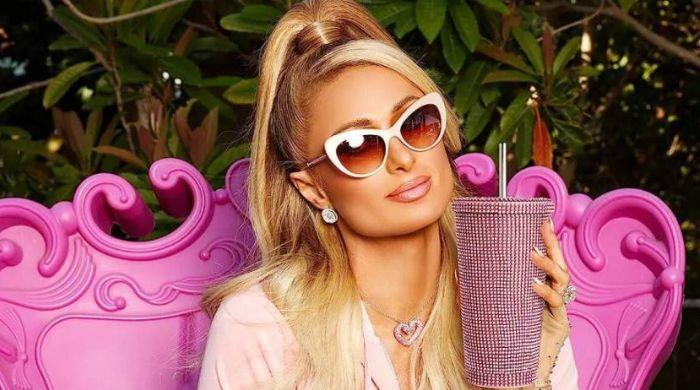Paris Hilton surprises fans with ‘stay like an icon’ suits at Beverly Hilton
