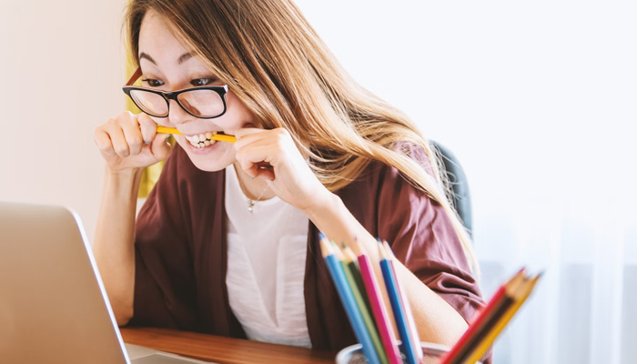 A representational image of a woman in stress at work. — Unsplash/File