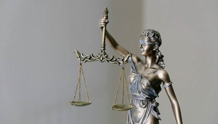 A representational image showing the scales of justice. — Unsplash