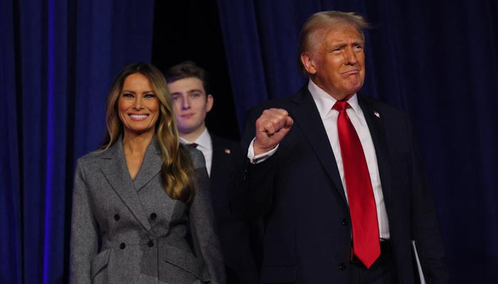 Republican presidential nominee Donald Trump makes a fist as he takes the stage with his wife Melania and son Barron to address supporters at his rally, at the Palm Beach County Convention Center in West Palm Beach, Florida, US, November 6, 2024. — Reuters
