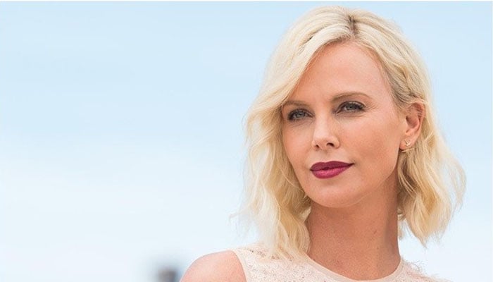 Charlize Theron brings back classic style in all white black outfit at Baby2Baby gala