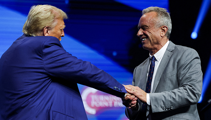 Robert F Kennedy Jr and President-elect Donald Trump greet each other at a campaign event sponsored by conservative group Turning Point USA, in Duluth, Georgia, US, October 23, 2024. — Reuters