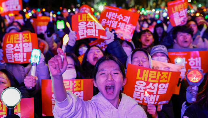 Protesters chant slogans as they attend a rally calling for the impeachment of South Korean President Yoon Suk Yeol, who declared martial law, which was reversed hours later, in front of the National Assembly in Seoul, South Korea, December 7, 2024. — Reuters