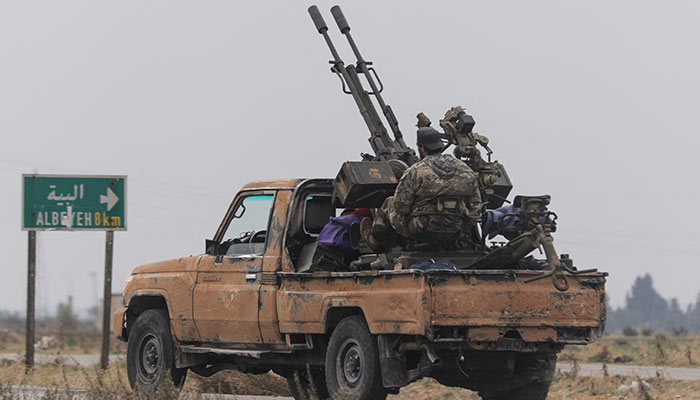 A rebel fighter sits on the back of a vehicle in Homs countryside, after Syrian rebels pressed their lightning advance on Saturday, saying they had seized most of the south, as government forces dug in to defend the key central city of Homs to try to save President Bashar al-Assads 24-year rule, in Syria December 7, 2024. — Reuters