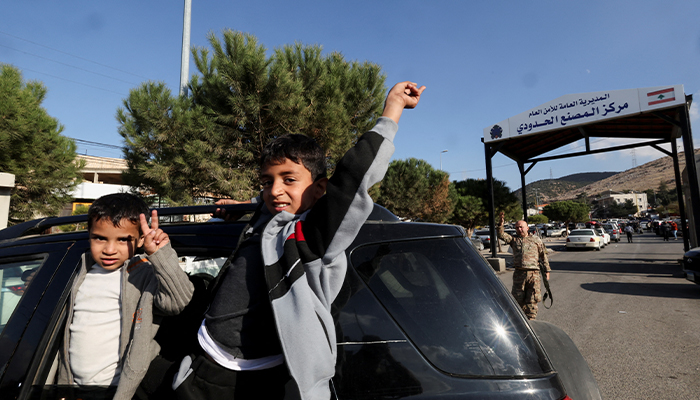 Children gesture at Masnaa Border Crossing, after Syrian rebels announced that they have ousted President Bashar al-Assad, Lebanon, December 8, 2024. — Reuters