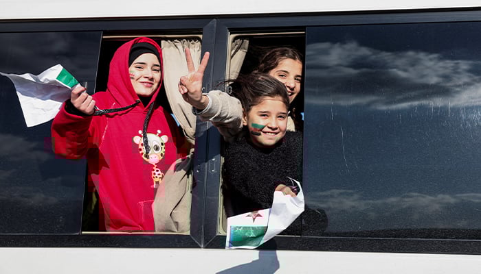 Syrians gesture from a bus as they are heading home to Syria, after Syrian rebels announced that they have ousted President Bashar al-Assad, at Majdal Anjar in Bekaa, Lebanon, December 8, 2024. — Reuters