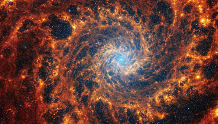 Spiral galaxy NGC 628, located 32 million light-years away from Earth, is seen in an undated image from the James Webb Space Telescope. — Reuters