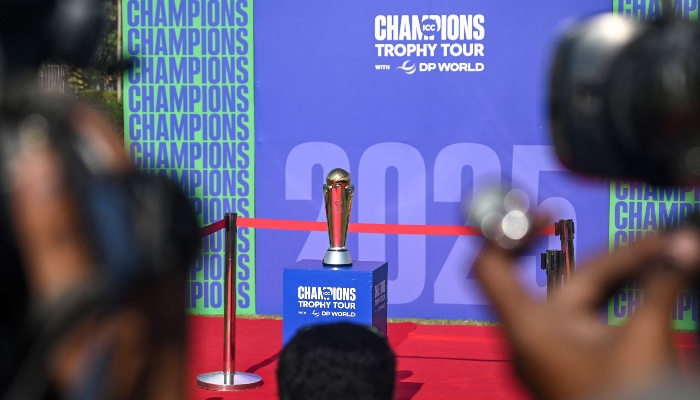 Cameraman take visuals of the winning trophy during ´ICC Champions Trophy´ tour at the National Stadium in Karachi on November 21, 2024. — AFP