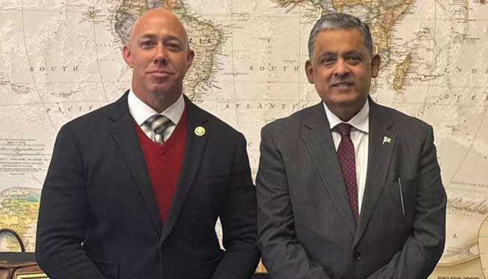 An undated image shows Pakistans Ambassador to US Rizwan Saeed Sheikh (right) poses for a photo with Chairman of the House Foreign Affairs Committee Rep Brian Mast in Washington, US. — X/@AmbRizSaeed