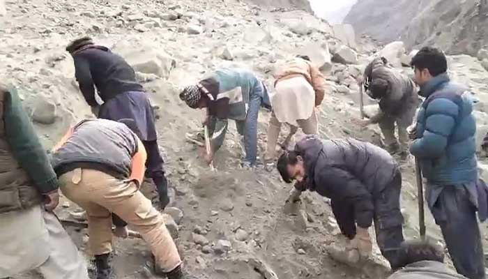 Local people are busy in rescue efforts to retrieve bodies of victims buried due to a landslide in Skardu on December 15, 2024. — Reporter