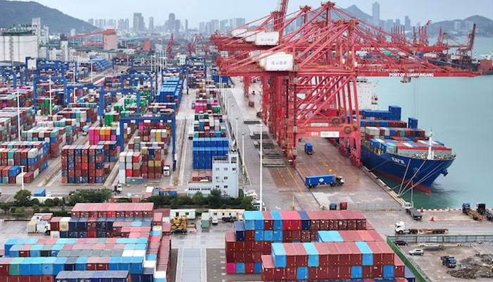 A drone view shows a cargo ship and shipping containers at the port of Lianyungang in Jiangsu province, China October 17, 2024. — Reuters