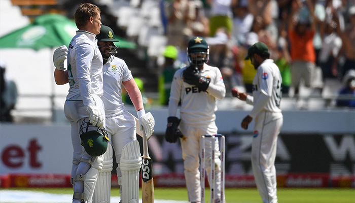 South Africas Ryan Rickelton (L) is congratulated by Temba Bavuma (2nd L) after scoring a century (100 runs) during the first day of the second international Test cricket match between South Africa and Pakistan at Newlands stadium in Cape Town on January 3, 2025. — AFP