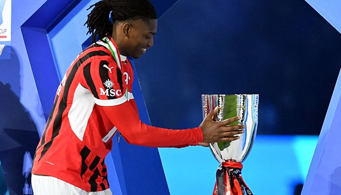 AC Milan's Rafael Leao touches the trophy after receiving the winners' medal during the trophy presentation, after the Italian Super Cup final against Inter Milan at Al Awal Park in Riyadh, Saudi Arabia on January 7, 2025. — Reuters