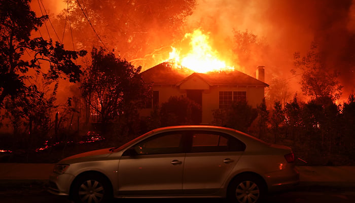 A house burns as powerful winds fueling devastating wildfires in the Los Angeles area force people to evacuate, at the Eaton Fire in Altadena, California, US January 8, 2025. — Reuters