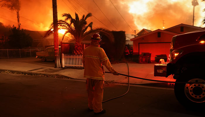 A firefighter works as powerful winds fueling devastating wildfires in the Los Angeles area force people to evacuate, at the Eaton Fire in Altadena, California, US on January 8, 2025. — Reuters