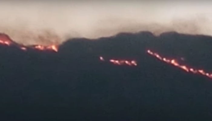 Fire can be seen on different locations on the mountains of the Sulaiman Range. — Screengrab via YouTube/Geo News/File