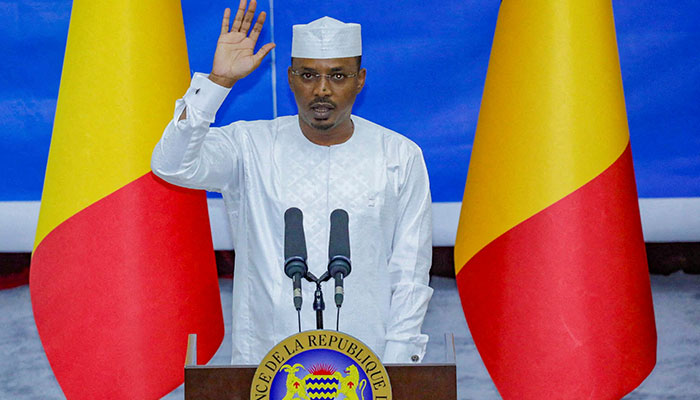 Chads newly elected President and junta leader Mahamat Idriss Deby raises his hand during his inauguration ceremony in Ndjamena, Chad May 23, 2024. — Reuters