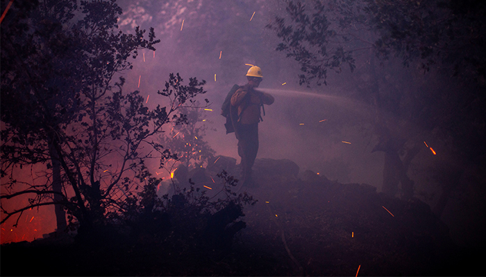 The wind whips embers while a firefighter battles the fire in the Angeles National Forest near Mt. Wilson as the wildfires burn in the Los Angeles area, during the Eaton Fire in Altadena, California, US January 9, 2025. — Reuters