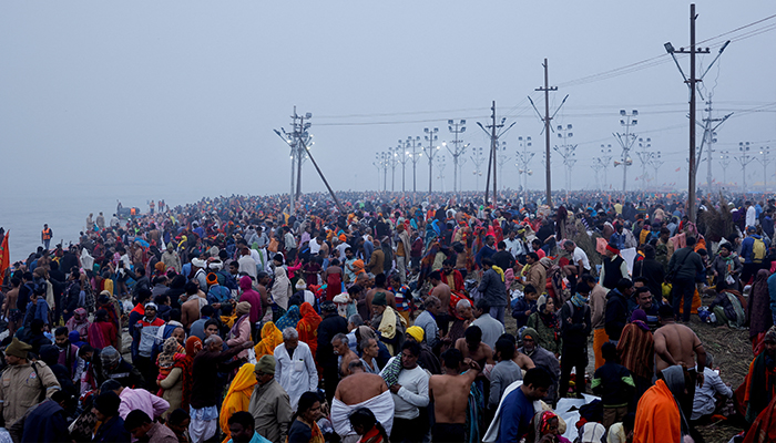 Devotees gather at the river bank to take a holy dip at Sangam, the confluence of the Ganges, Yamuna and Saraswati rivers, during the Maha Kumbh Mela, or the Great Pitcher Festival, in Prayagraj, India, January 13, 2025. — Reuters
