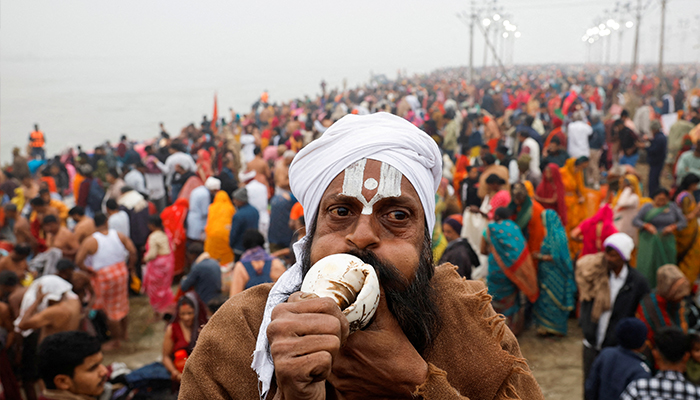 A Sadhu or a Hindu holy man prays on the day devotees take a holy dip at Sangam, the confluence of the Ganges, Yamuna and Saraswati rivers, during the Maha Kumbh Mela, or the Great Pitcher Festival, in Prayagraj, India, January 13, 2025. — Reuters